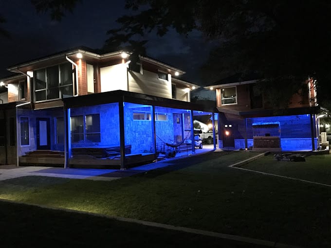 house with special blue lights installed around the front porch